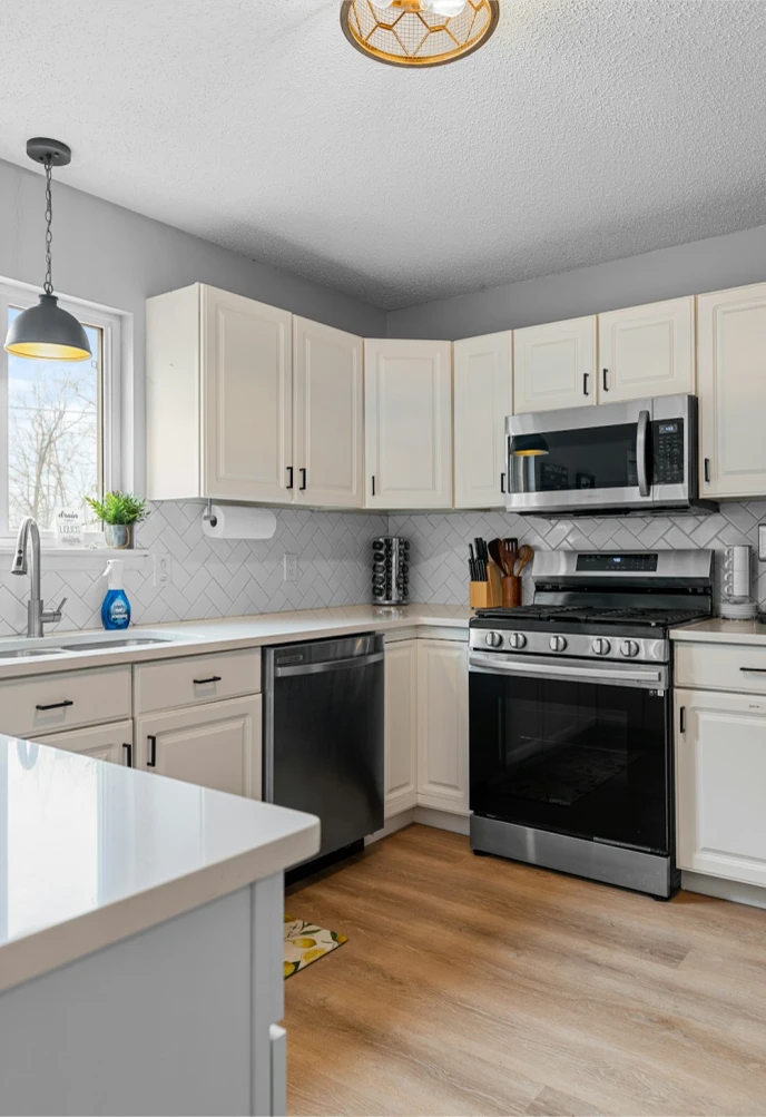 Bright modular kitchen with white cabinets